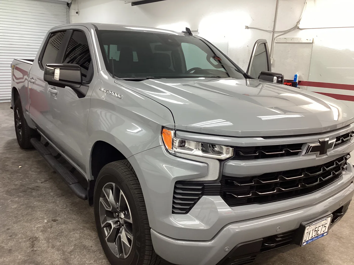 Silver Chevrolet pickup inside Superior — window tint photo collection